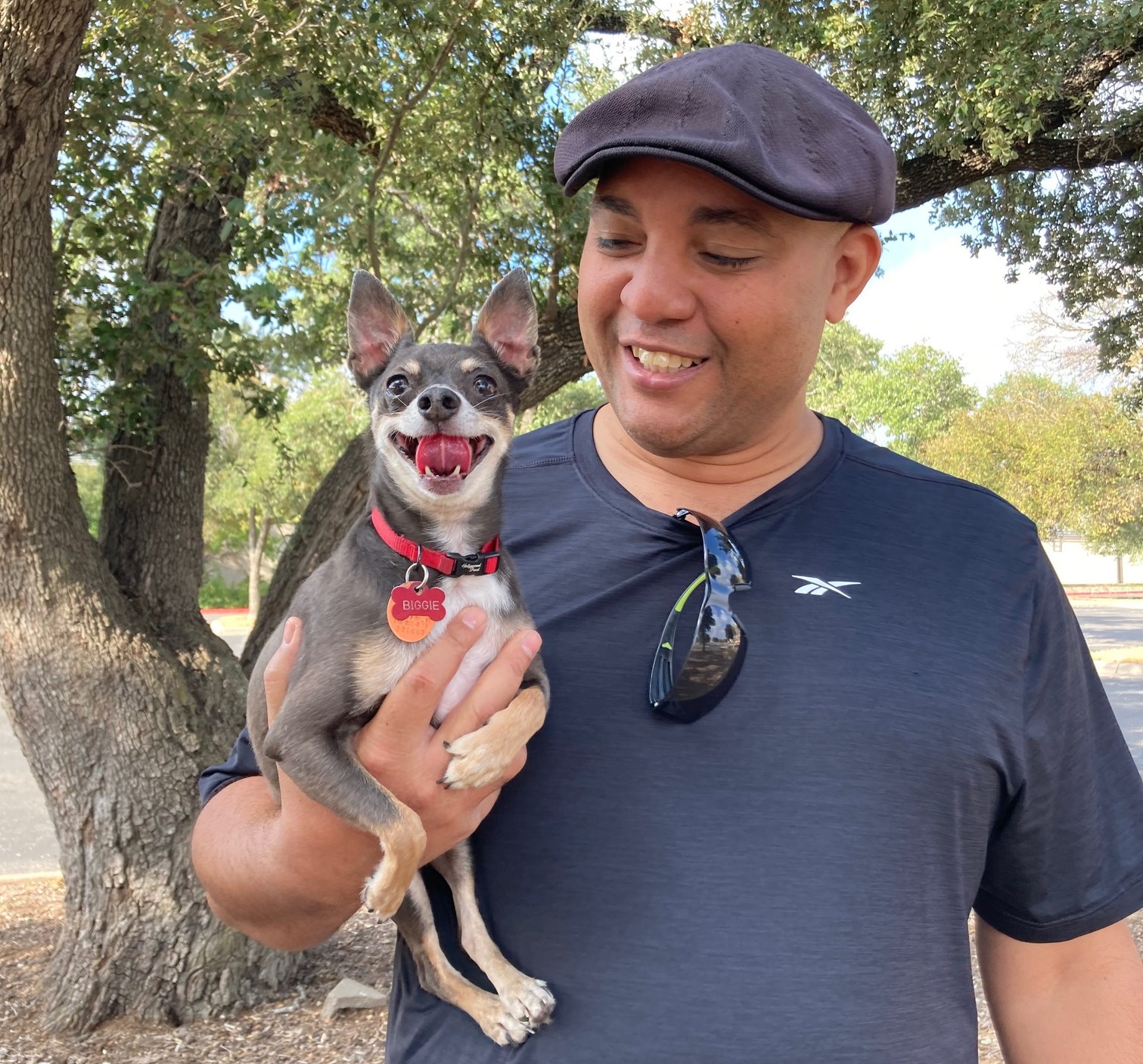 Dimitri Arozarena, founder of Cuban Thai Kitchen, outdoors with his Russian Toy Terrier, Biggie